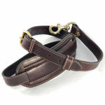 Load image into Gallery viewer, Burgundy leather shoulder strap coiled showing buckle and shoulder pad
