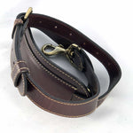 Load image into Gallery viewer, Burgundy leather shoulder strap coiled showing billet and snap clip
