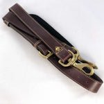 Load image into Gallery viewer, Burgundy leather shoulder strap flat showing buckle and snap clips
