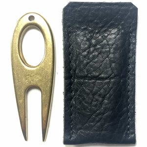 Golf divot tool solid brass with aniline leather sleeve, vertical sleeve side by side.