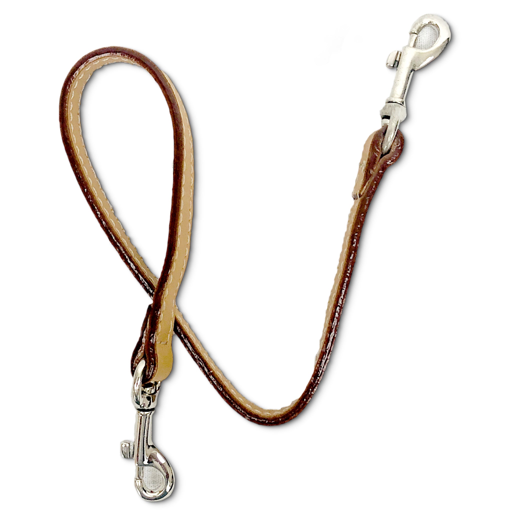 Leather key lanyard in saddle tan on its side to show the edge